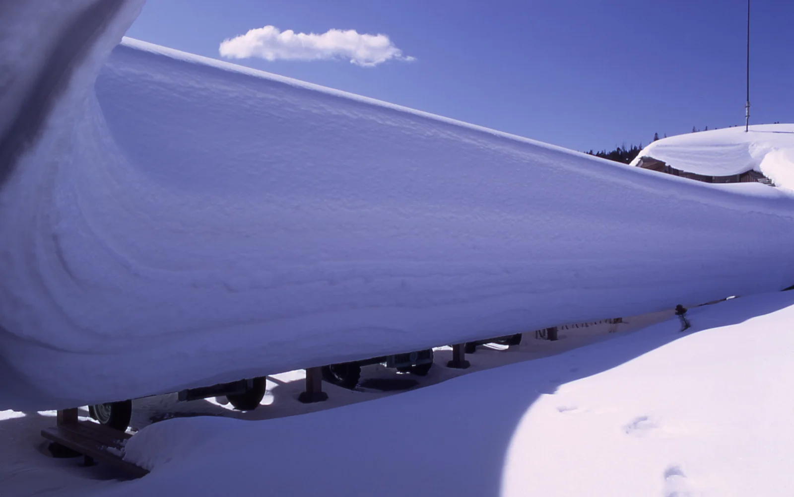 Snow overhang on a building in the winter